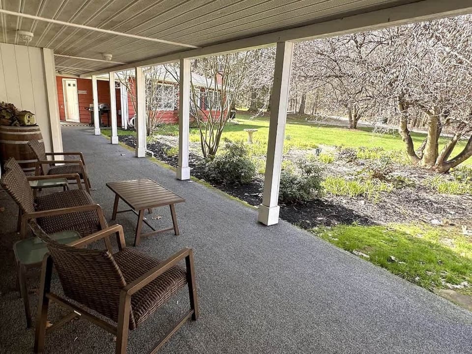 Covered Front Porch - Separate Game Cabin rental in the background.
