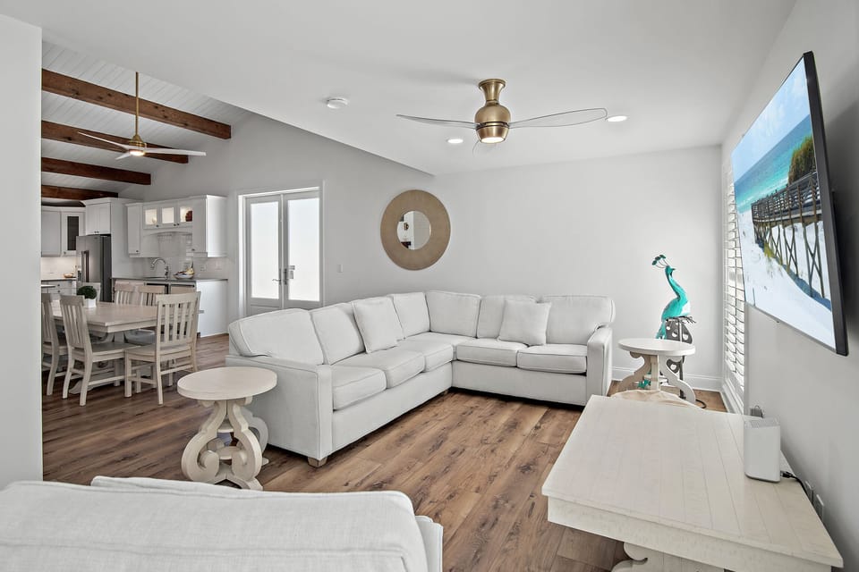 Second Floor Living Space is Stunning with Vaulted Ceilings, a Chef's Kitchen, Large Dining Room, and a Wrap Around Balcony with Gulf Views