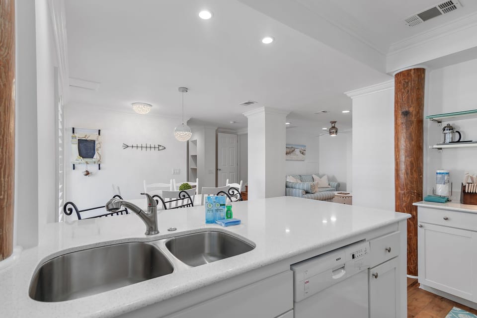 1st Floor Living Space - Large, Open Kitchen, Dining, and Living Space with Comfortable Seating around a large Smart TV, Dining Space for 9