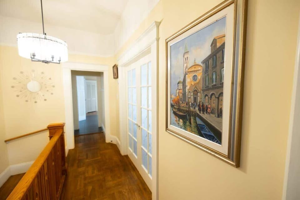 From upstairs, a well-lit and welcoming corridor guides you to the bedrooms