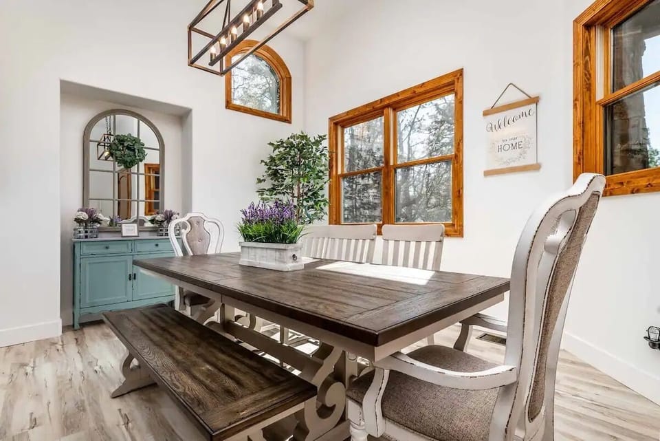 Dining area in main living room with table to comfortably seat 8 