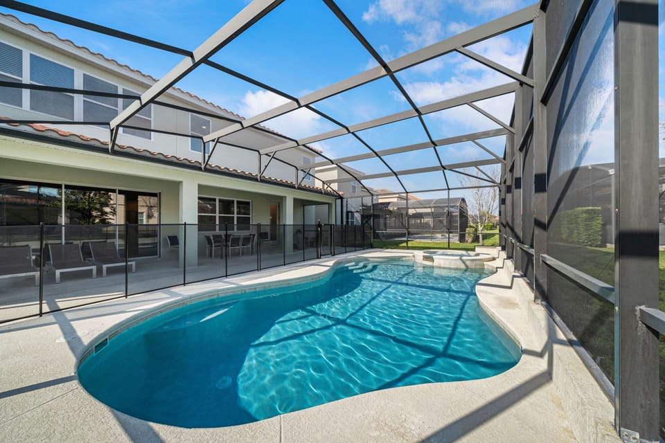 - Splash into the private screened pool with attached spa jets  
- Lounge on poolside chairs or dine outdoors under covered patio  
- Family-friendly safety gate adds comfort for group stays