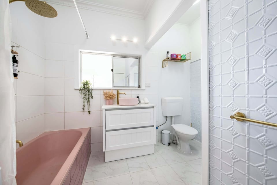 Bathroom 1 - Shower, Bath, Toilet + Laundry