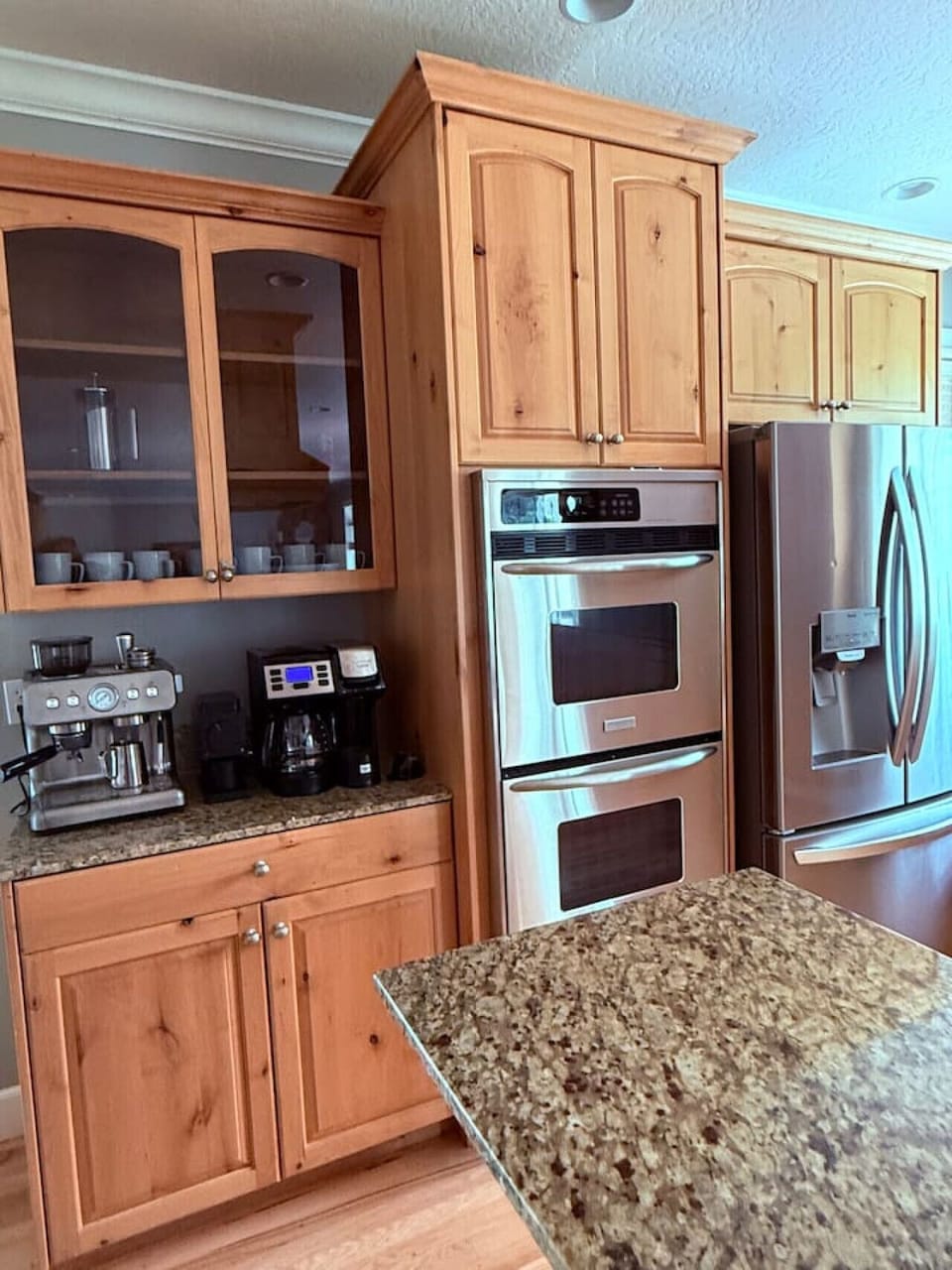 Dedicated coffee bar featuring an espresso machine, French press, drip coffee maker, Keurig, and electric tea kettle. A complimentary starter supply of coffee and tea is provided to help you settle in.