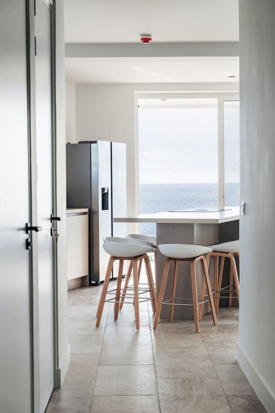 Stylish kitchen nook! Perfect for quick bites and coffee chats, all while enjoying that beautiful view!