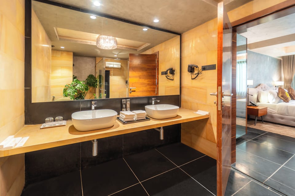 Executive Suite, Balcony, City View | Bathroom | Slippers, bidet