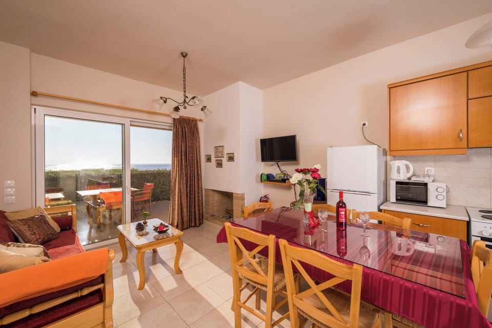 Comfort Villa, Sea View | Living area | 32-inch Smart TV with satellite channels