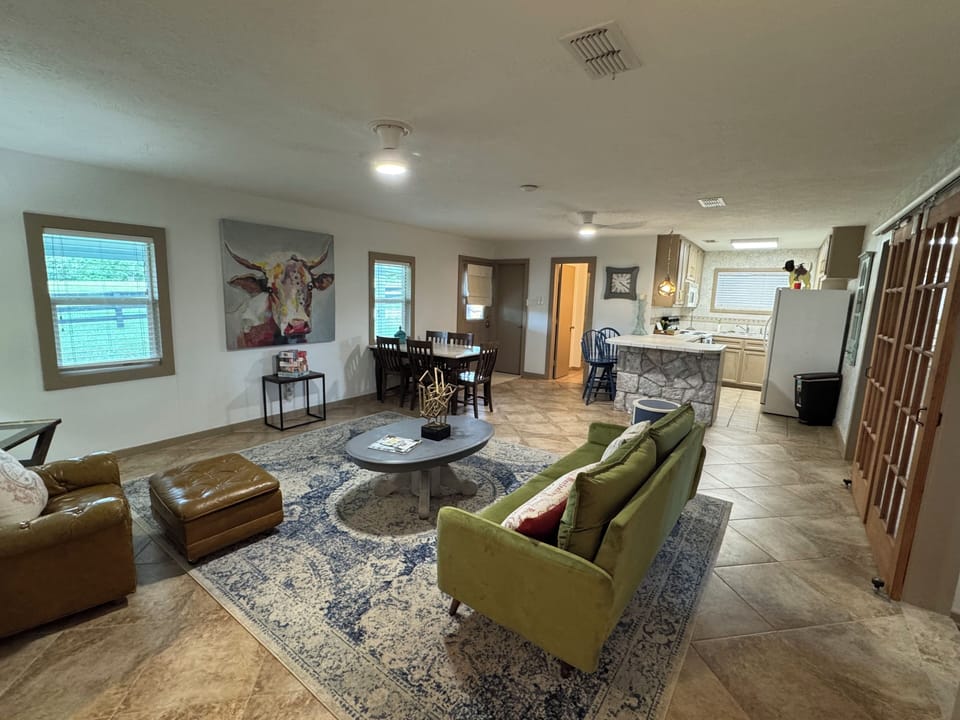 Open living room and kitchen with cooking supplies provided.