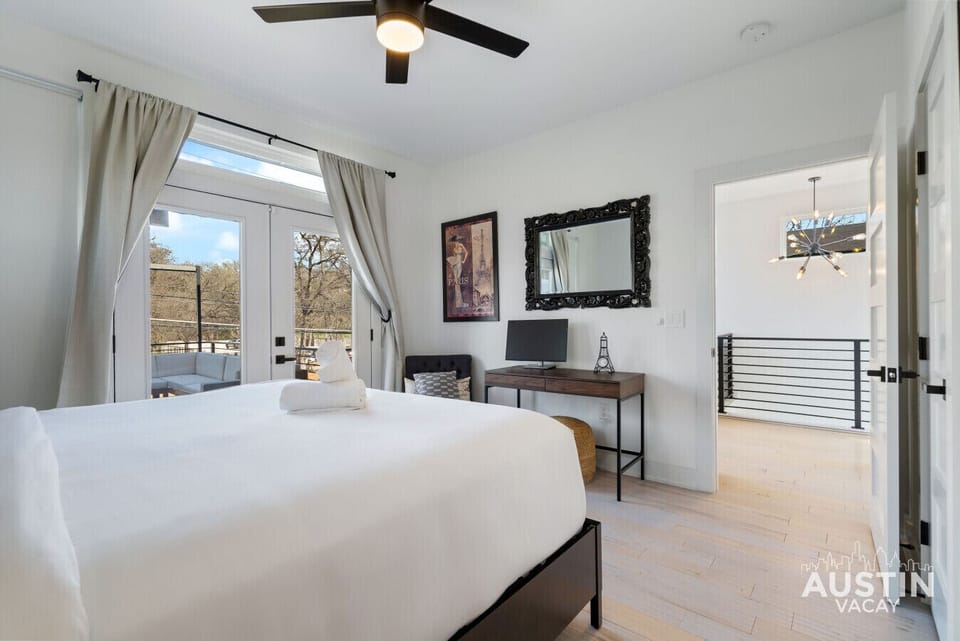 Rise and shine with balcony views! This airy bedroom has comfy vibes, a workspace, and easy access to your own private terrace.