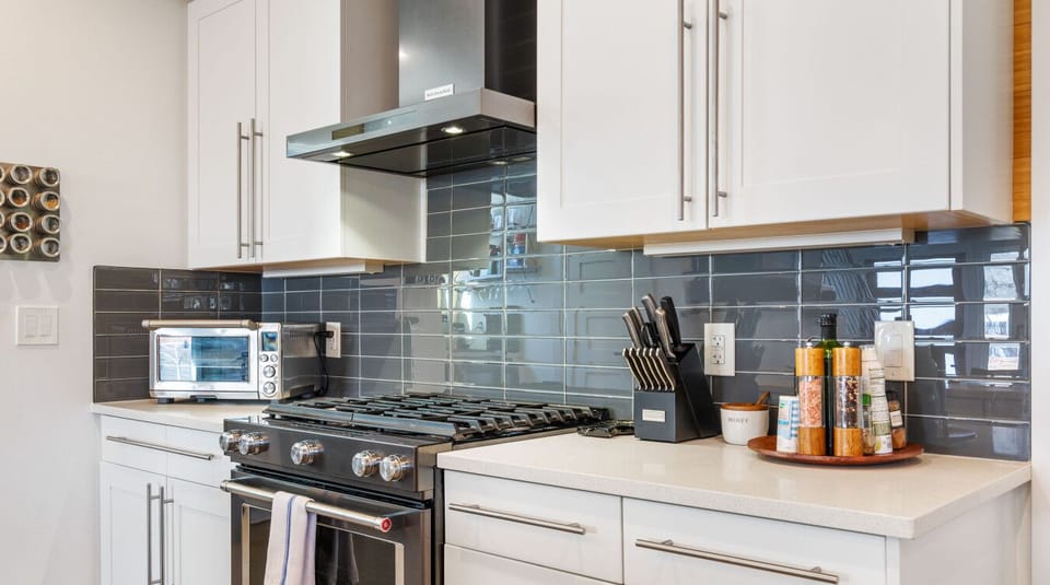 Cook with ease! This kitchen features sleek stainless steel appliances, a gas range, and the essentials to get you started.