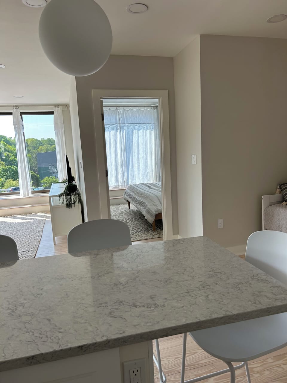 View from kitchen into the bedroom and living room