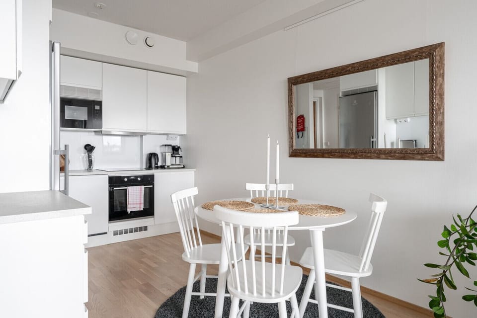 Prepare your favorite meals in a fully equipped kitchen featuring integrated Electrolux appliances and a convenient coffee station.