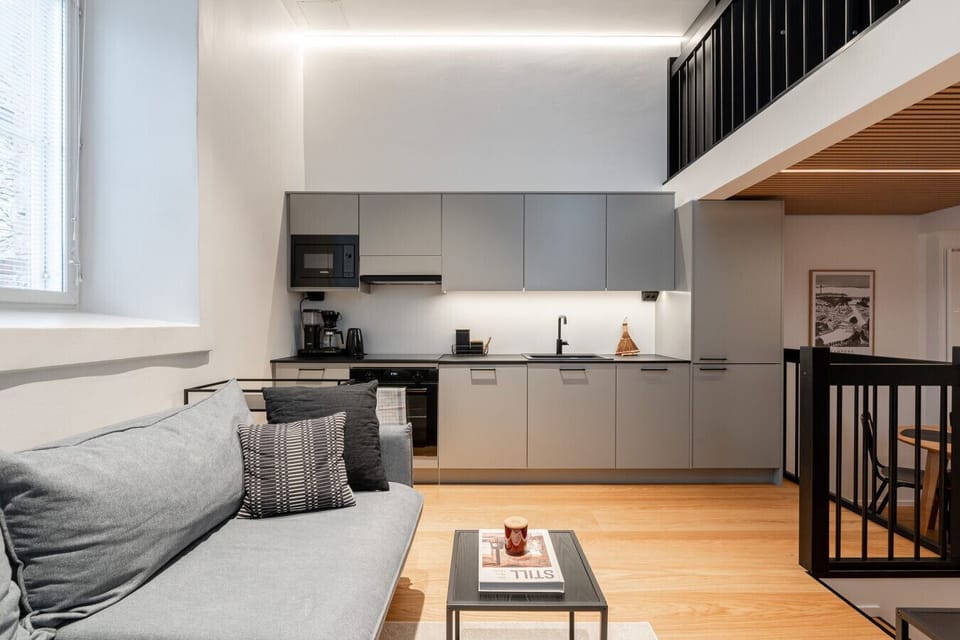 Prepare your favorite meals effortlessly in the fully equipped modern kitchen, which includes all essential appliances and a dishwasher. The open-concept layout allows you to socialize with your travel companions on the sofa while you cook.