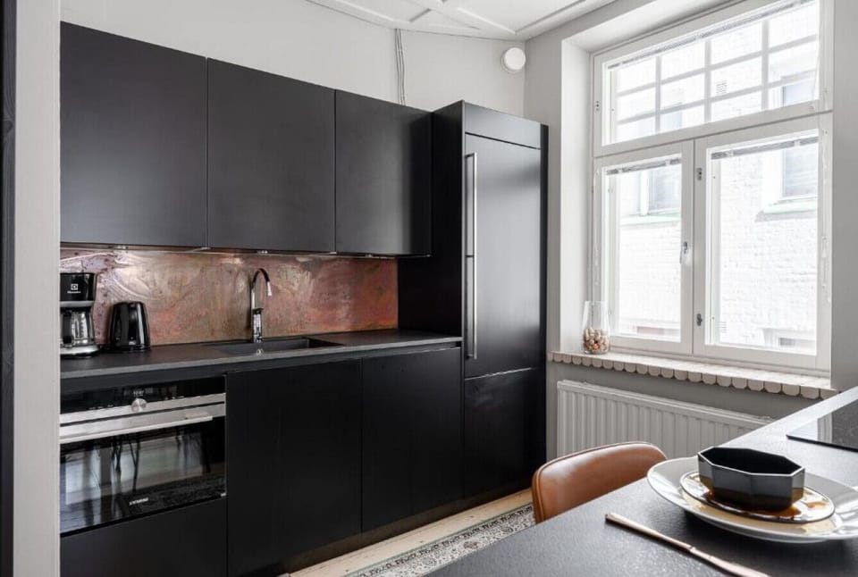 Apartment kitchen is well equipped and includes everything you need for your stay in Tampere