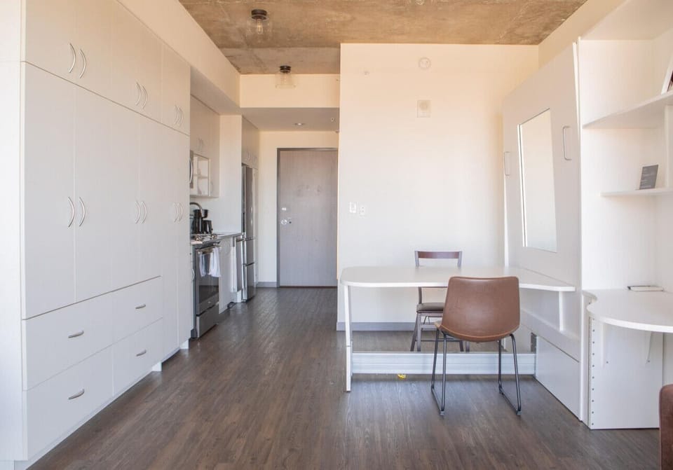 Smartly designed Murphy bed transforms the space in seconds—enjoy a comfortable night’s sleep without sacrificing daytime living space