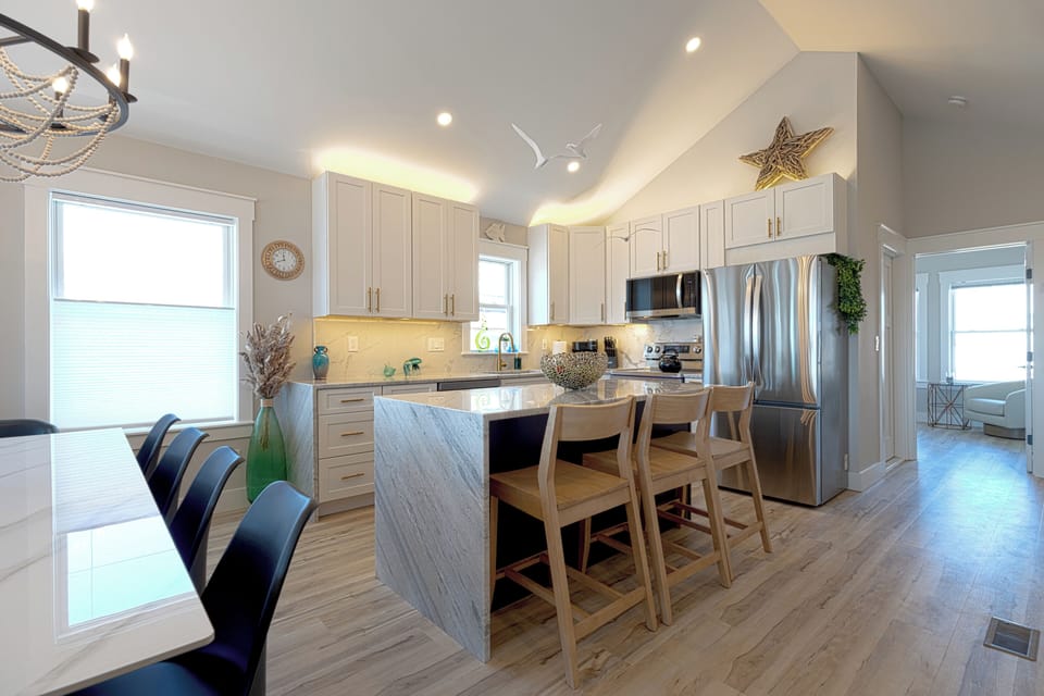 High-end kitchen is fully stocked with all one could want. Just bring food!