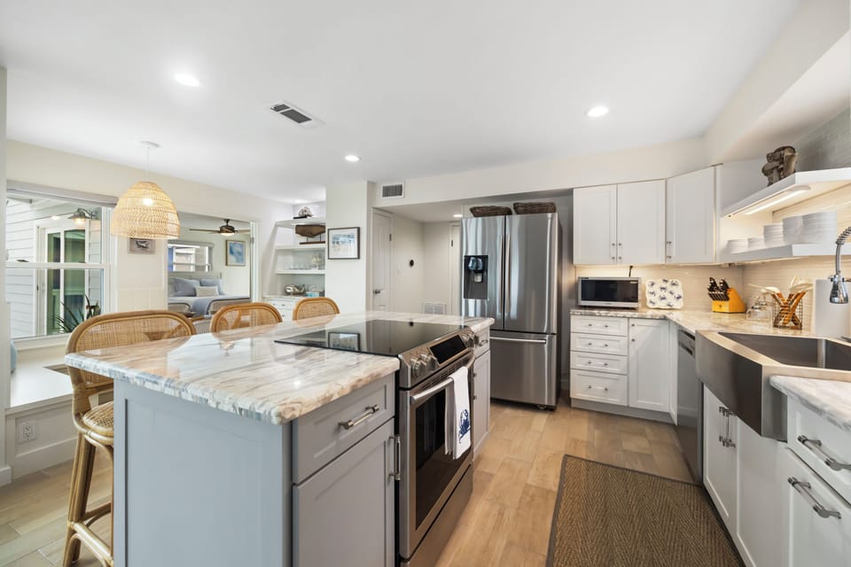 A well equipped kitchen with open shelving, and all the comforts of home.
