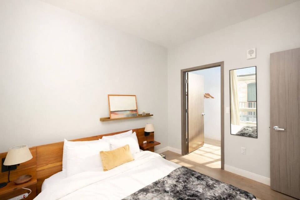 Minimalist design meets maximum comfort in this quiet, cozy bedroom
