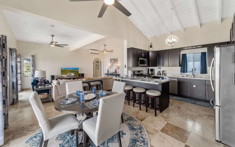 Gather around for meals with your loved ones at the spacious dining table.