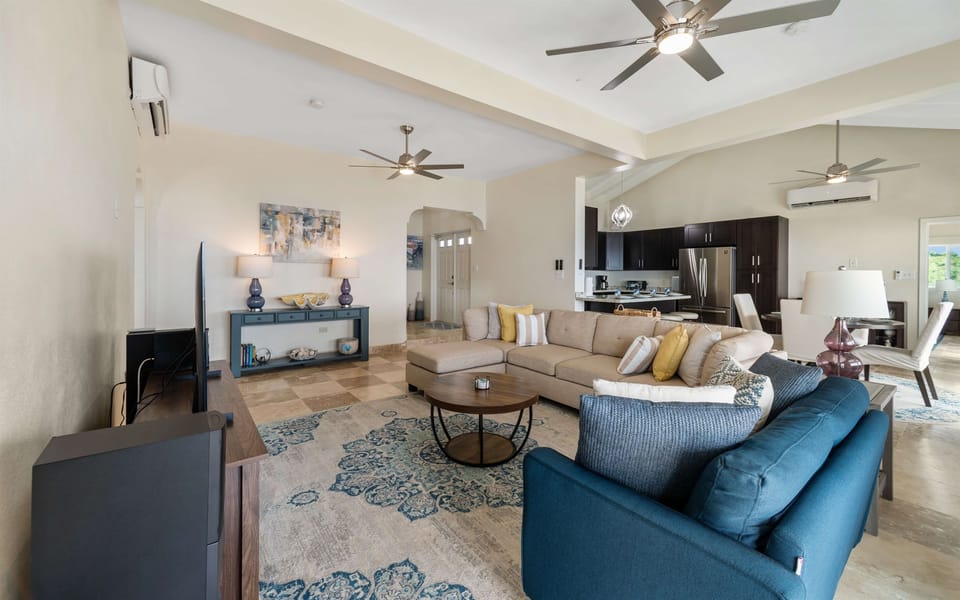 Relax on plush sofas while enjoying the sea breeze flowing through.