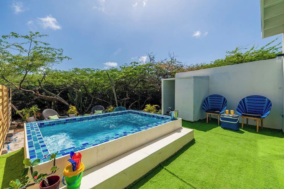 Step outside and relax in our inviting pool area, complete with comfortable seating for lounging and enjoying the sun.