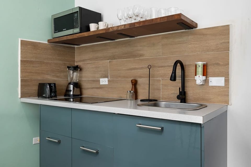 Fully Equipped Kitchen: Cook with ease using the stove, fridge, freezer, microwave, toaster, blender, and coffee maker, all thoughtfully provided for your convenience.
