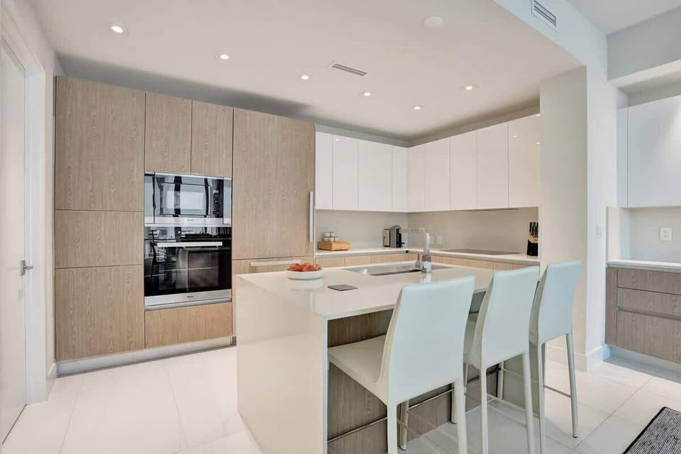 Sleek modern kitchen with island and built-ins