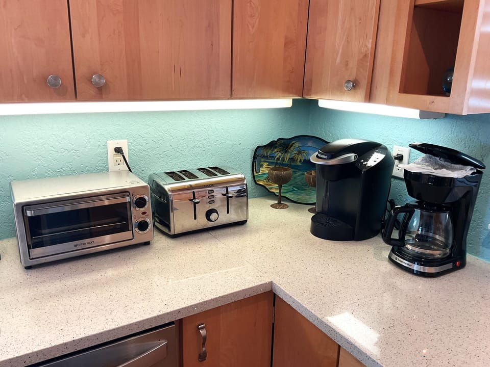 Both styles of coffee makers, Keurig and regular glass pot style