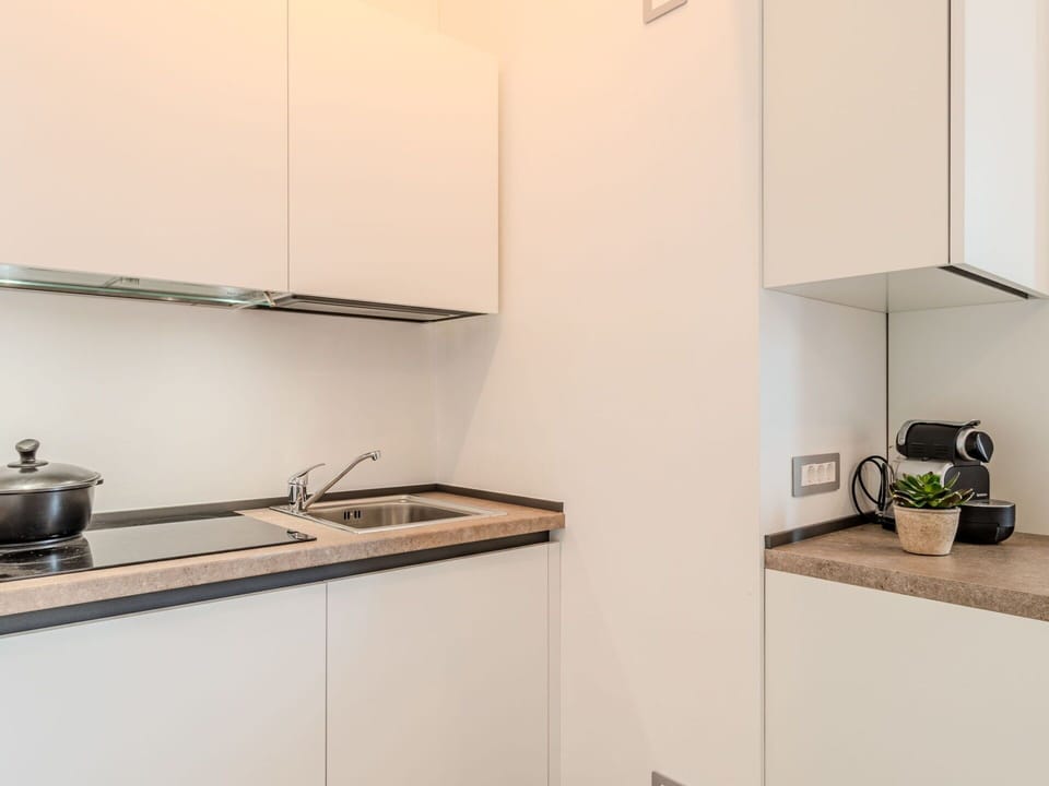 Countertop, Kitchen, Interior Design, Kitchen Appliance, Cabinetry, Wood, Flooring, Furniture, Major Appliance, Room