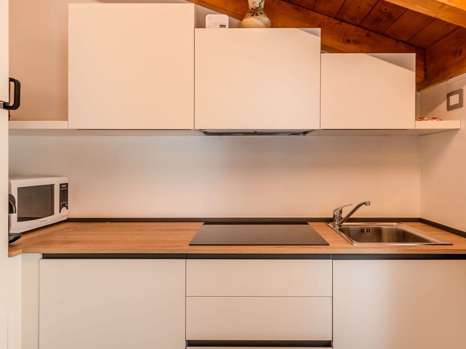 Kitchen, Kitchen Appliance, Countertop, Interior Design, Major Appliance, Cabinetry, Flooring, Wood, Furniture, Home Appliance