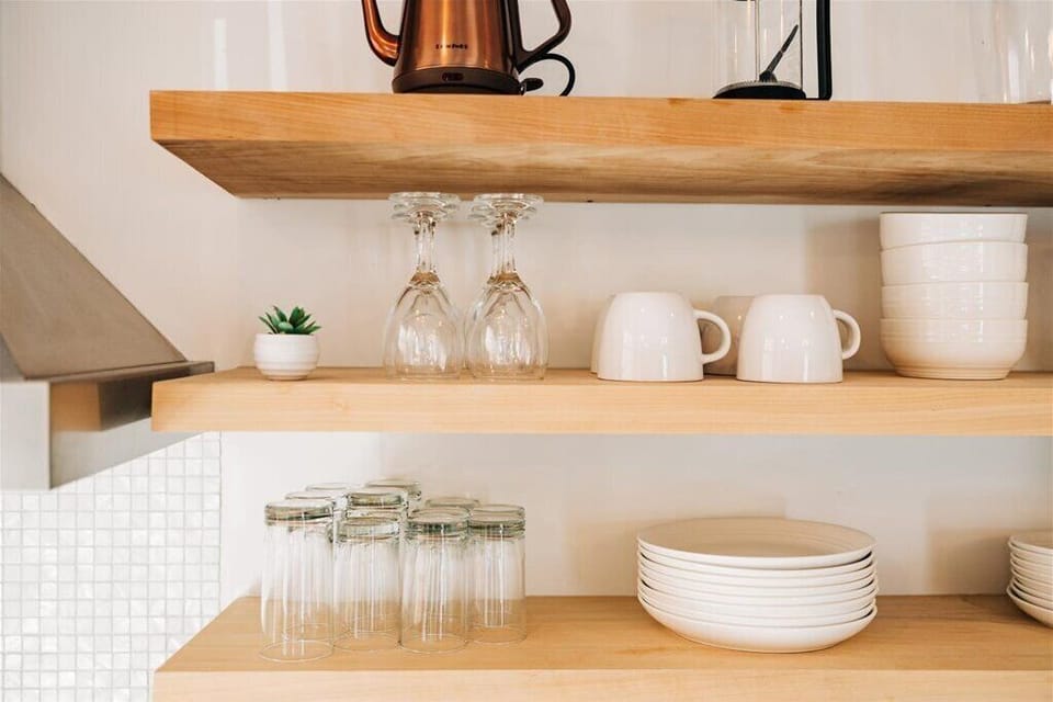 Dishes and glassware are easy to find on this stylish open shelving. 
