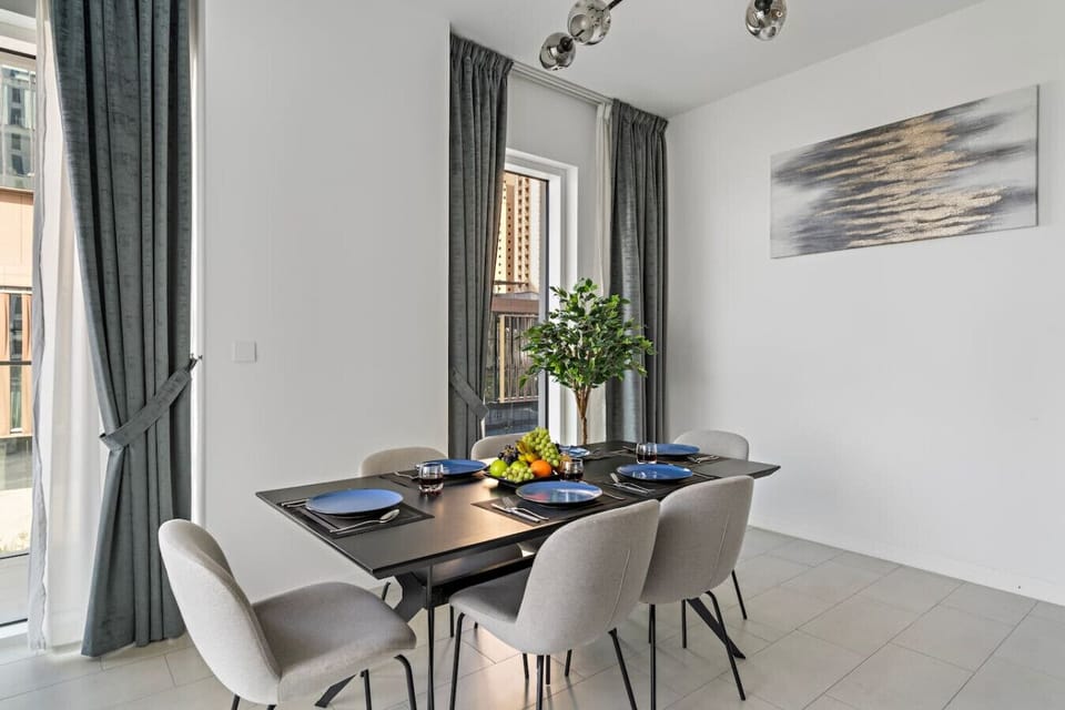 Dining Room: Enjoy elegant meals under modern lighting in this chic dining space!