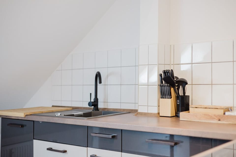Sleek and functional kitchen space with full equipment for home-style cooking.