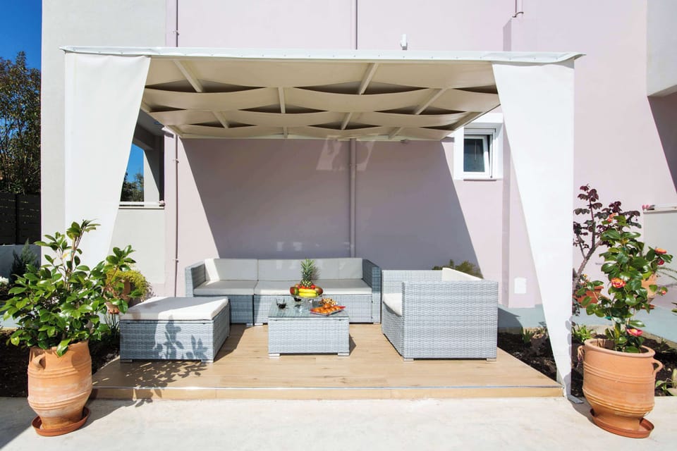 Shared Outdoor Patio – Shaded area ideal for dining and unwinding with a gentle sea breeze.