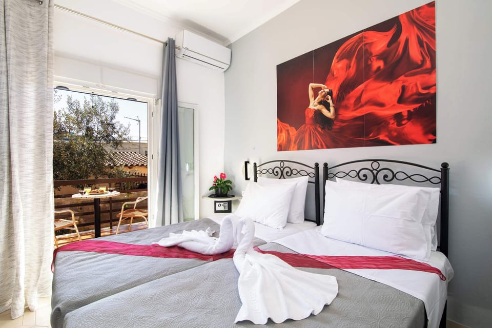 Room with Balcony Access – Bright and airy space with direct access to the outdoors.