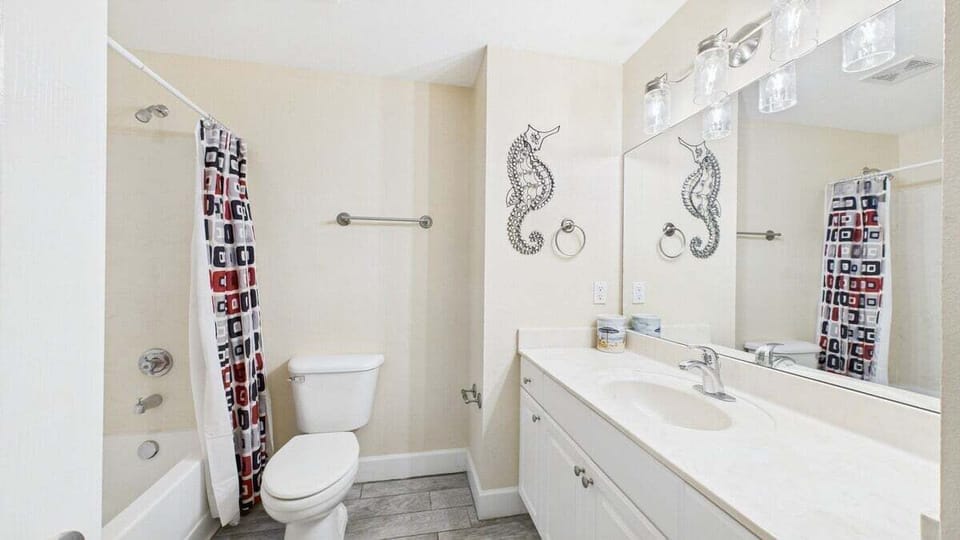 Primary bathroom with shower and tub combo