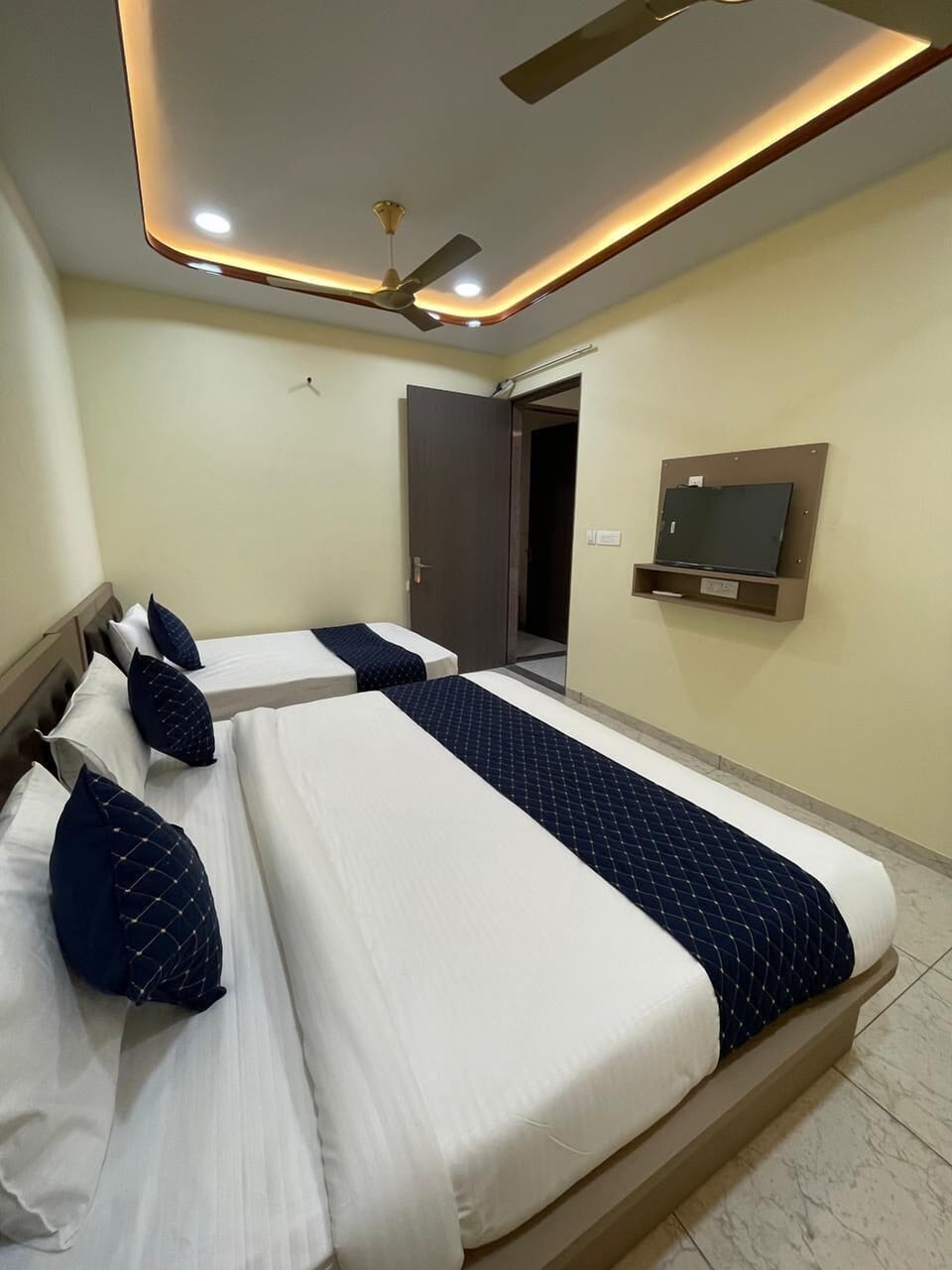 Deluxe Triple Room, Private Bathroom | In-room safe, desk, blackout drapes, iron/ironing board (on request)