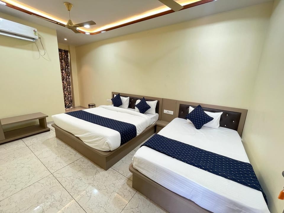 Deluxe Triple Room, Private Bathroom | In-room safe, desk, blackout drapes, iron/ironing board (on request)