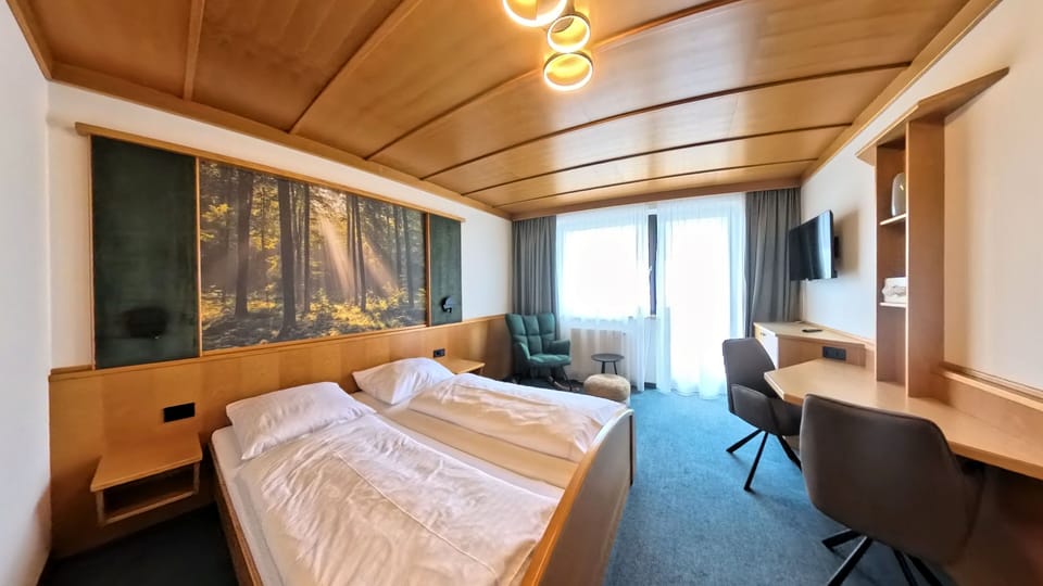 Comfort Double or Twin Room, Balcony, Garden View | Minibar, desk, laptop workspace, blackout drapes