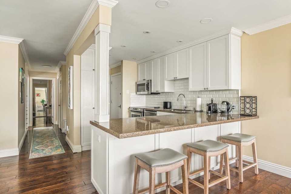 Bright and spacious kitchen, fully equipped for effortless coastal dining experiences.