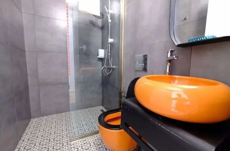 Shower, hair dryer, slippers, towels