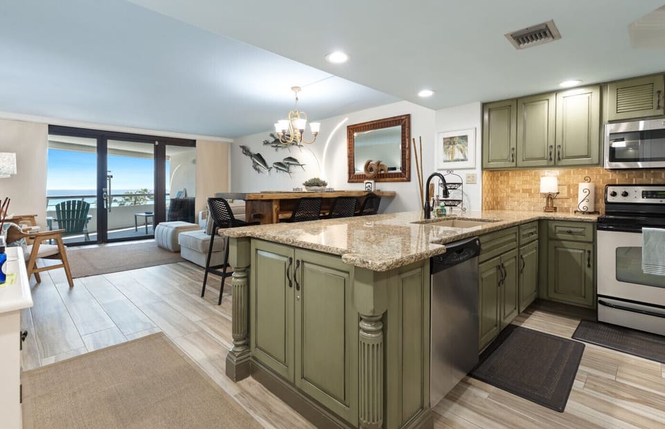 Entry to condo kitchen, dining, and living.