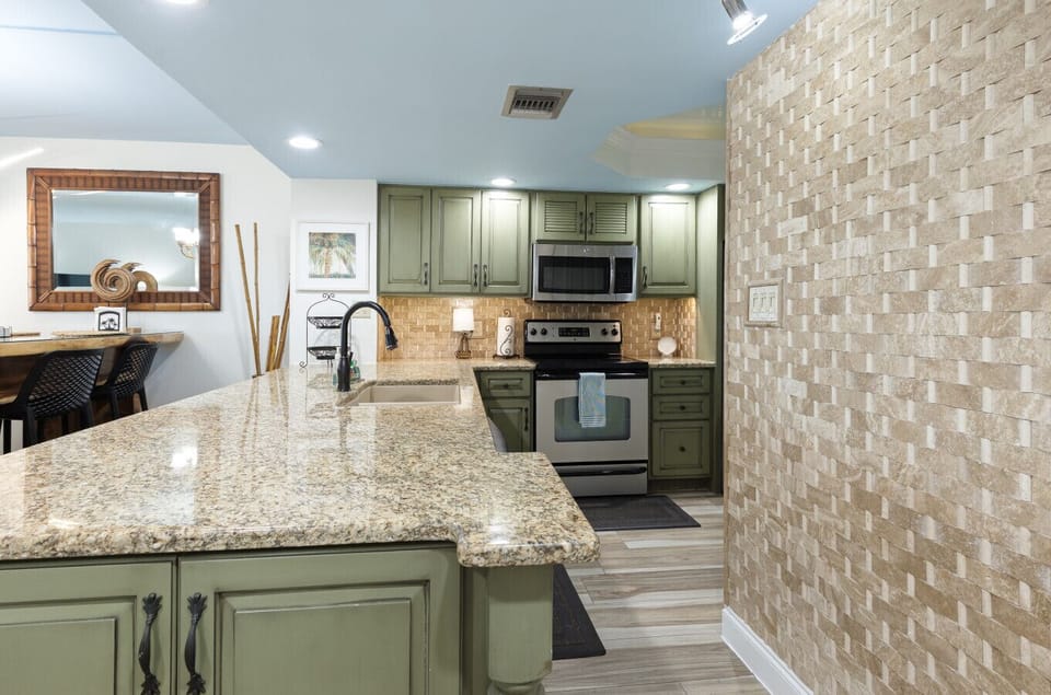 Entry to kitchen, coffee bar, and laundry.