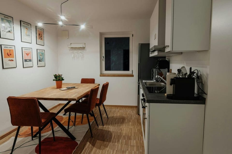 Fully equipped open-plan kitchen with all essentials including coffee machine, microwave and stove – cook like at home.
