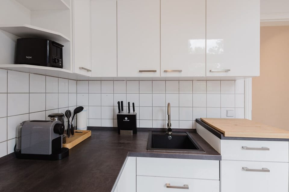 Enjoy your morning brew with a view – stylish and practical kitchen amenities.