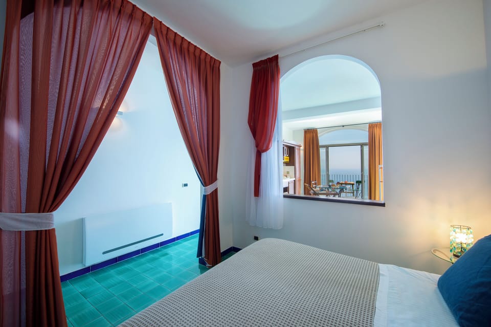 Deluxe Quadruple Room, Sea View | Premium bedding, down comforters, minibar, in-room safe