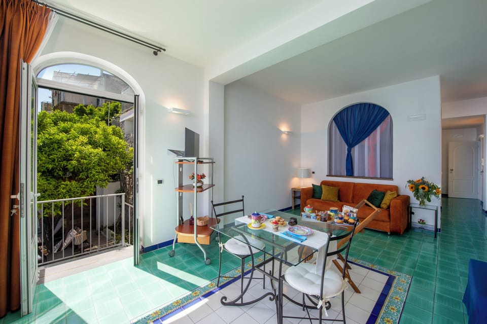 Deluxe Quadruple Room, Sea View | Premium bedding, down comforters, minibar, in-room safe
