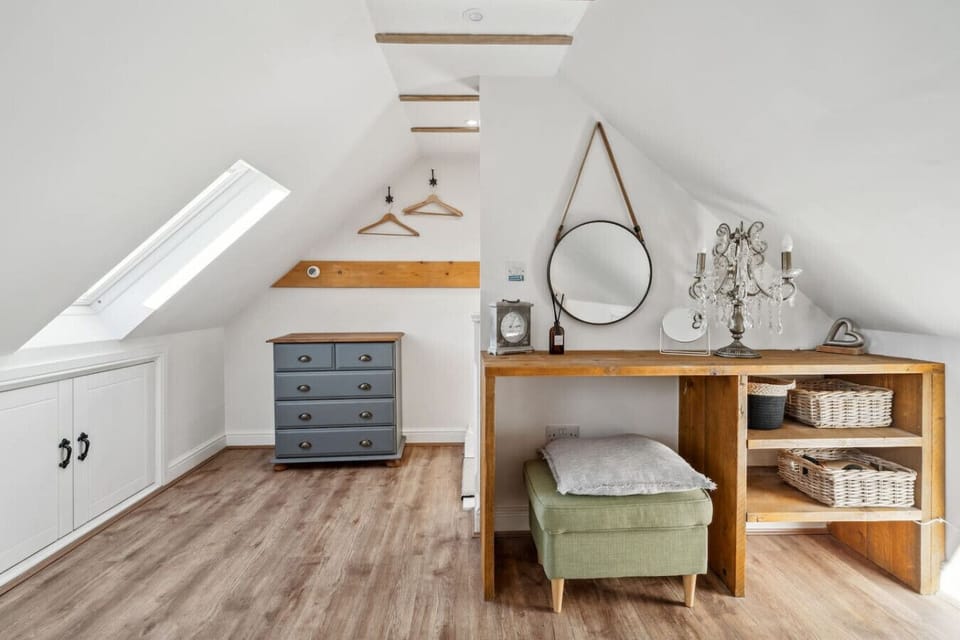 Dressing area with chest of drawers and mirror