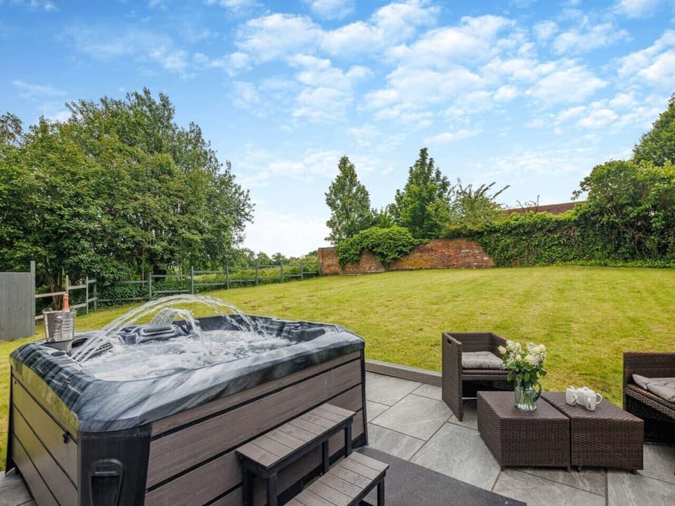 Private hot tub on the patio, perfect for unwinding.