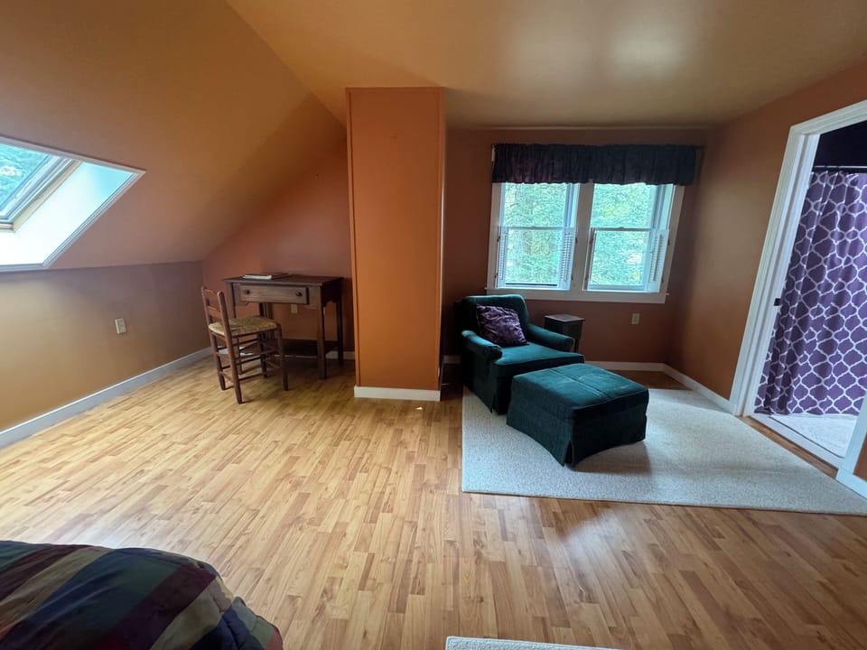 Work space (high speed internet) and sitting area in primary bedroom. 